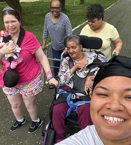 Group of diverse people enjoying a sunny walk in the park